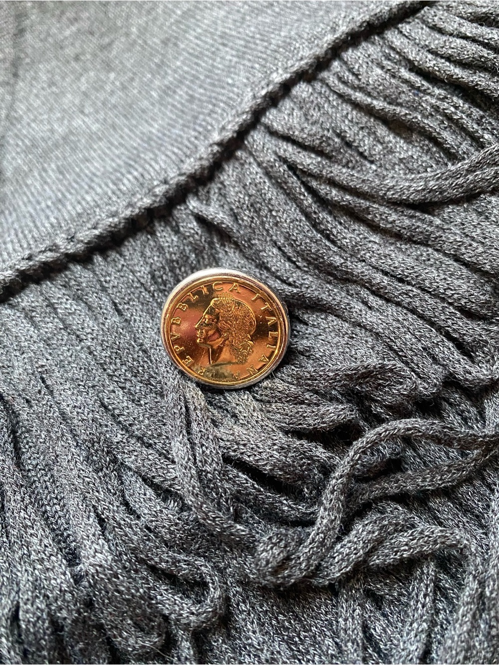 Source Unknown Gold-Tone Coin Ring on Gray Textile